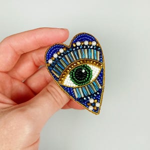Evil eye heart brooch. Blue gold heart brooch. Green eye brooch.