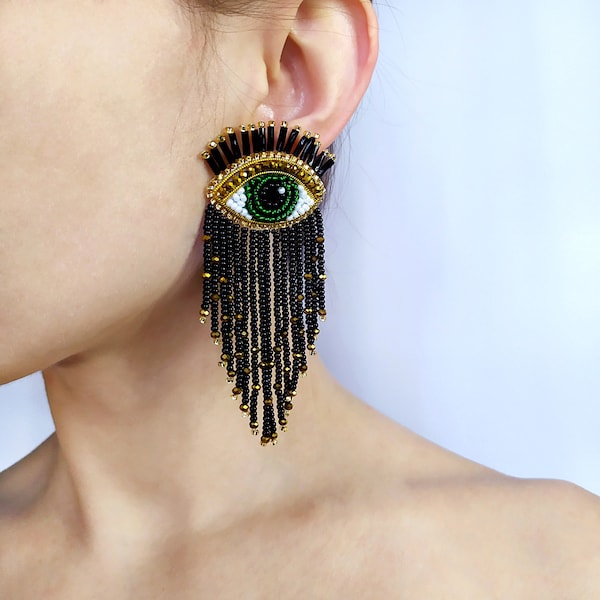 Evil eye beaded earrings. Black and gold fringe earrings.