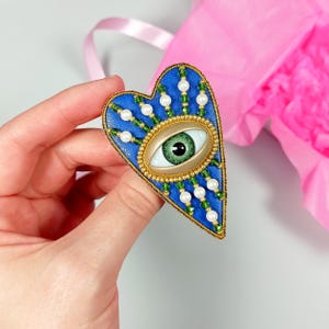 Evil eye heart brooch. Blue, green, gold heart brooch. Green eye brooch.