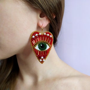 Evil eye earrings. Gold and red heart earrings. Large statement earrings.