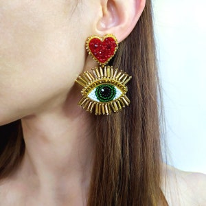 Evil eye earrings. Gold and red heart earrings.