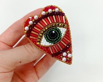 Evil eye heart brooch. Red gold heart brooch. Green eye brooch.