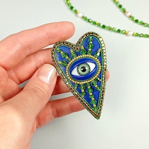 Evil eye heart brooch. Blue, green, gold heart brooch. Green eye brooch.