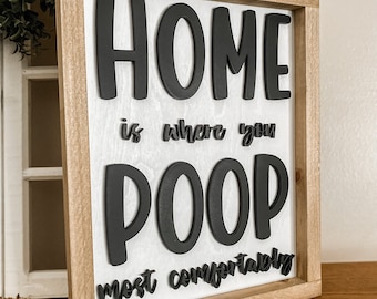 Letrero divertido para el baño: «El hogar es donde haces caca más cómodamente». Decoración
