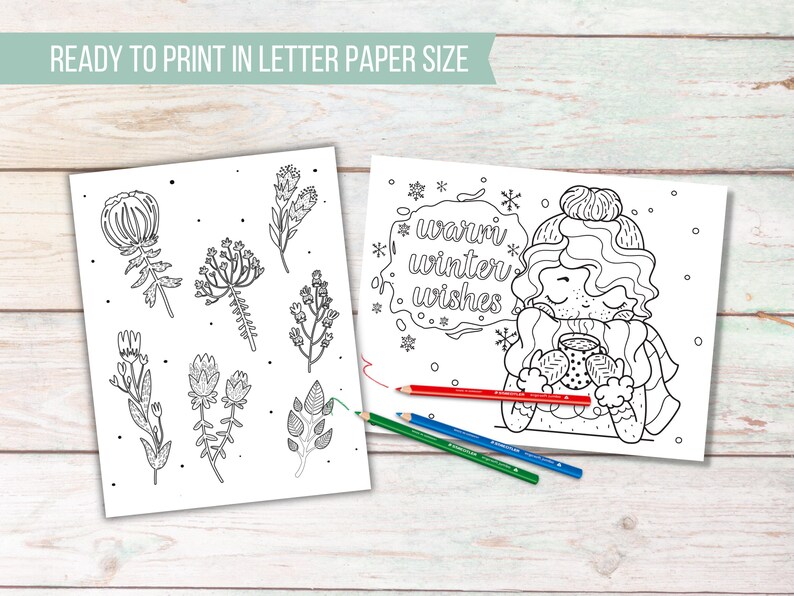 May include: Two printable coloring pages on a wooden surface. One page features botanical illustrations, the other has a winter theme with the text "warm winter wishes." Colored pencils in red, green, and blue are present.