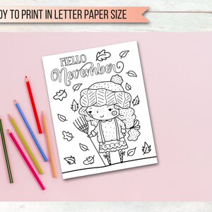 May include: Black and white coloring page featuring a girl wearing a hat and sweater holding a rake. The text "HELLO November" is at the top of the page.