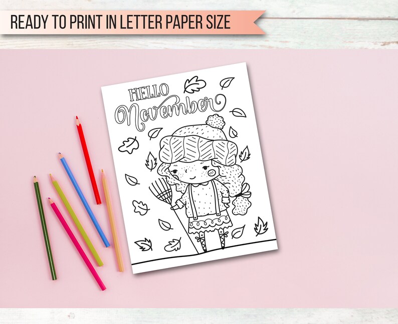May include: Black and white coloring page featuring a girl wearing a hat and sweater holding a rake. The text "HELLO November" is at the top of the page.