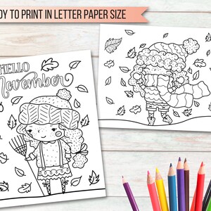 May include: Black and white coloring page featuring two girls wearing winter hats and scarves. One girl is holding a rake and the other is surrounded by falling leaves. The text "HELLO November" is at the top of the page.