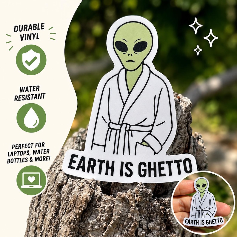 May include: A white vinyl sticker featuring a green alien in a white robe. The sticker has the text "EARTH IS GHETTO" in black. The sticker is durable and water resistant, ideal for laptops, water bottles & more!