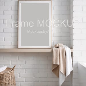 Portrait mat frame on the shelf in bathroom mockup, Portrait frame mockup Ratio 2:3, Bathroom interior frame mockup, Restroom frame mockup