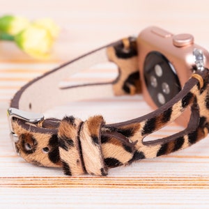 May include: A brown and black leopard print Apple Watch band with a rose gold watch face.