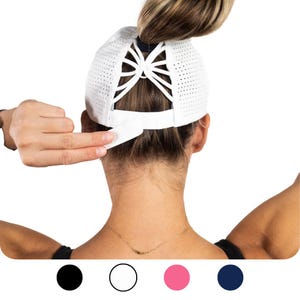 May include: White mesh baseball cap with a ponytail hole in the back. The cap is available in black, white, pink and navy blue.