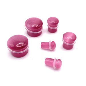 Quality Pink Cats Eye Stone Single flared Plug with O ring available in sizes 3mm (8G) - 16mm (5/8")