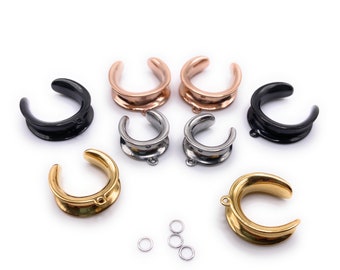 May include: A set of eight ear gauges in various colors, including black, silver, gold, and rose gold. The gauges are made of stainless steel and have a smooth, polished finish. The set also includes three small jump rings.