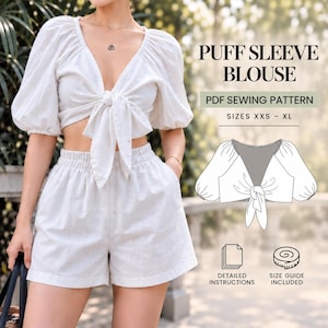 Könnte beinhalten: Eine weiße Bluse mit Puffärmeln, Frontbindung und passender Shorts. Das Bild enthält den Text PUFF SLEEVE BLOUSE, PDF SEWING PATTERN, SIZES XXS - XL, DETAILED INSTRUCTIONS, SIZE GUIDE INCLUDED sowie eine Strichzeichnung des Oberteils.