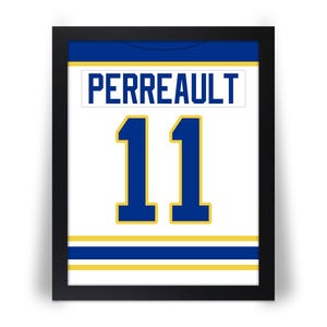 May include: Framed jersey art featuring the name "PERREAULT" above the number "11". The jersey is white with blue and gold accents, set against a black frame. The artwork is a sports-themed item.