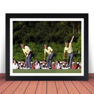 May include: A framed photograph of a golfer in three different poses on a golf course. The golfer is wearing a yellow shirt and plaid pants. The golfer is holding a golf club in each pose. The background is a green golf course with trees in the distance.