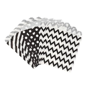 May include: A set of black and white patterned paper gift bags. The bags feature polka dots, stripes, and chevron patterns.