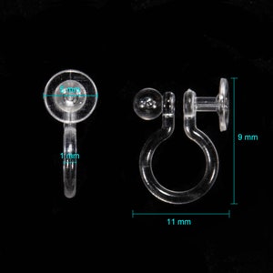 May include: Clear plastic earring backs with a 9 mm diameter and a 11 mm length. The backs have a small ball on one side and a flat disc on the other.