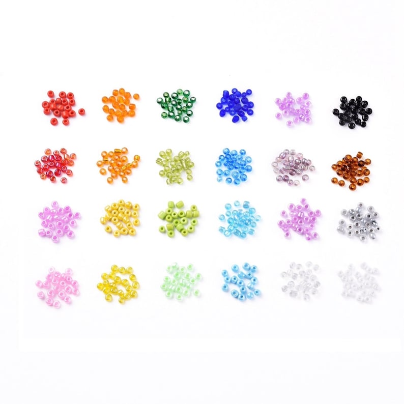 May include: Assortment of 20 small glass seed beads in various colors, including red, orange, yellow, green, blue, purple, brown, black, and clear.