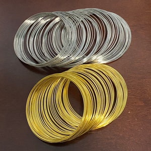 50g of ongeveer 110 zilveren lussen of 65 gouden lussen, staalgoud of zilver / staalkleur geheugendraad voor het maken van armbanden, doe-het-zelf sieraden