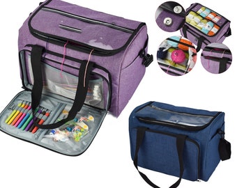 May include: Two yarn storage bags, one purple and one blue, with multiple compartments and a clear top window. The bags have handles and adjustable straps. The purple bag is open and shows a variety of yarn, needles, and other craft supplies.