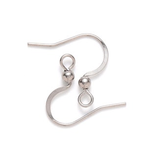 May include: A pair of silver earring hooks with a small ball at the end of each hook.