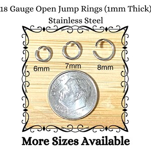 May include: Stainless steel open jump rings in 6mm, 7mm, and 8mm sizes. The image shows three rings next to a dime for size comparison. Text reads "18 Gauge Open Jump Rings (1mm Thick)" and "More Sizes Available."