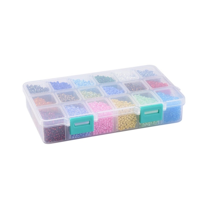 May include: A clear plastic storage box with 16 compartments filled with colourful seed beads. The box has green latches on the sides.