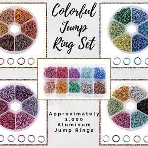 May include: A set of six containers filled with approximately 1,000 aluminum jump rings in assorted colors. The containers are arranged in a hexagon shape. The text "Colorful Jump Ring Set" and "Approximately 1,000 Aluminum Jump Rings" is visible in the image.