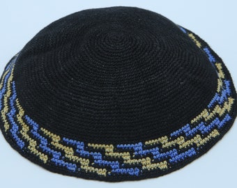 May include: Black knitted kippah with a blue and gold patterned trim.