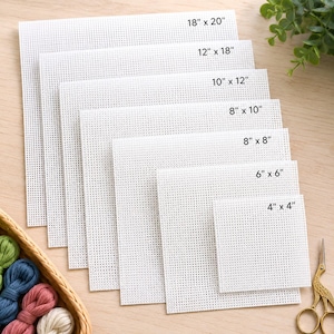 May include: A set of white square and rectangular needlepoint canvas sheets with a grid pattern. The sizes are labeled as 18" x 20", 12" x 18", 10" x 12", 8" x 10", 8" x 8", 6" x 6", and 4" x 4". The sheets are stacked in a cascading arrangement.
