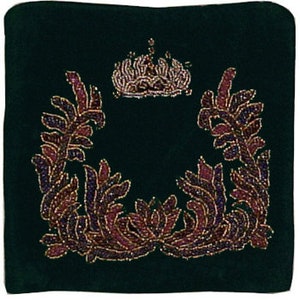 May include: A dark green velvet cushion with a gold and purple beaded design. The design features a crown at the top and a wreath of leaves on either side.