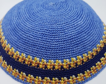 May include: A blue knitted kippah with a navy blue and gold trim.