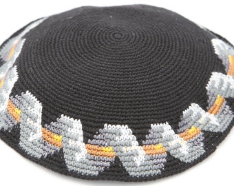 May include: A black crocheted kippah with a gray and orange patterned trim.