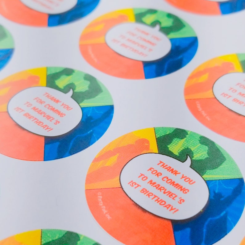 May include: Round stickers with a colorful comic book design. The stickers feature a speech bubble with the text "Thank you for coming to Marvel's 1st Birthday!"