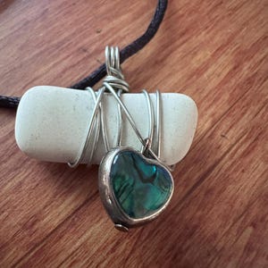 May include: A set of three ceramic mugs with a speckled, matte finish. Each mug features a different color: light blue, cream, and gray. The mugs have a simple, modern design and a comfortable handle.