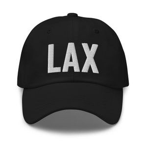 May include: Black baseball cap with white embroidered text "LAX" on the front.