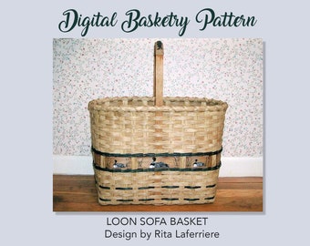 May include: A woven brown basket with a wooden handle. The basket has a black and white striped band with a design of three loon birds. The basket is labelled "LOON SOFA BASKET Design by Rita Laferriere".