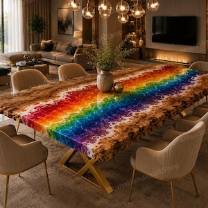 May include: A rectangular dining table featuring a natural live-edge wood border and a central resin inlay displaying a vibrant rainbow gradient. The table is supported by a gold-toned metal X-frame base and is surrounded by eight beige upholstered chairs.