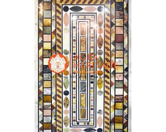 May include: A rectangular marble table top with a mosaic design. The mosaic features a central rectangular panel with geometric patterns, surrounded by borders of various colors and shapes, including squares, triangles, and ovals. The outer frame is white marble.