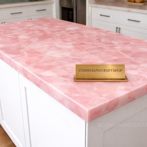 Luxury pink Rose Quartz side table with translucent stone top and smooth glossy finish