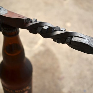 Hand forged RxR spike bottle opener