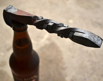 Hand forged RxR spike bottle opener