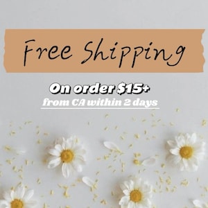 May include: Free shipping on orders over $15 from California within 2 days. The image features white daisies scattered on a white background.