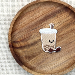 May include: A handmade wooden sign with the text "Welcome to our home" in a handwritten style. The sign is painted white with a dark stained frame. A small, decorative heart is attached to the bottom.