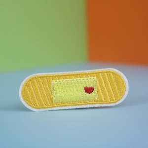 Hartpatch pleister: geborduurde opstrijkappliqué