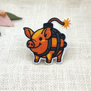 Orange Pig Bomb Patch: Embroidered Animal Iron-On Applique