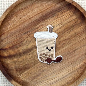 May include: A rustic wooden sign with the text "Welcome to our home" in white lettering. The sign features a distressed finish and a simple, inviting design, perfect for entryway decor.