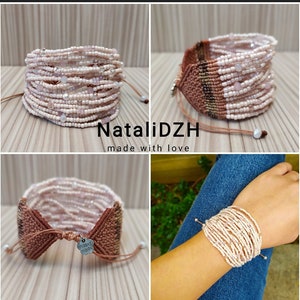 May include: A multi-strand bracelet made with pink and brown beads. The bracelet is tied with a brown cord and has a small metal tag that says "hand made".